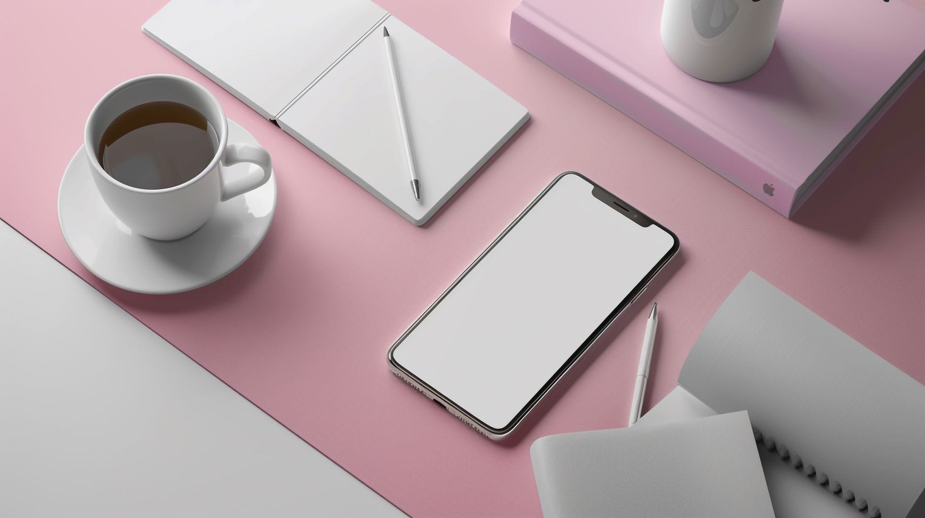 Nowoczesne biurko z pustym smartfonem, kawą i akcesoriami na różu