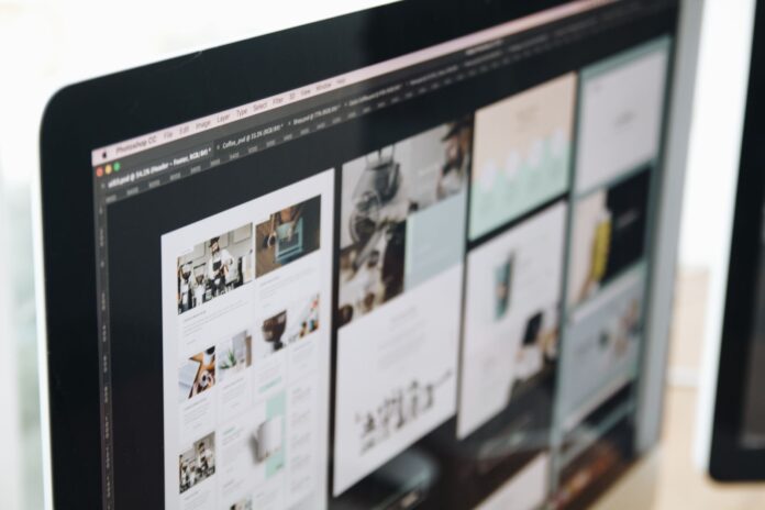 Monitor komputera z projektem strony internetowej w przestrzeni roboczej Monitor komputera z projektem strony internetowej w przestrzeni roboczej